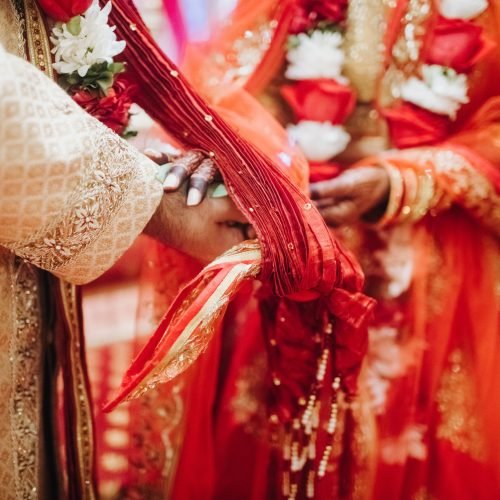 Ritual with coconut leaves during traditional Hindu wedding ceremony