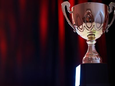 trophy against stage red light on curtain as background